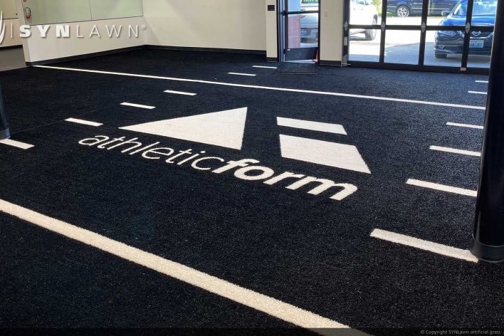 image of SYNLawn Maui HI prefab turf logos for athletic weight room applications